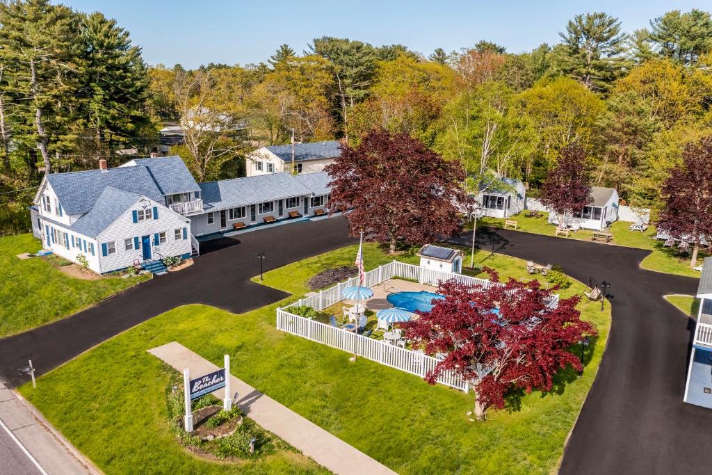 an aerial view of a home with a driveway at The Beaches Guestrooms and Cottages in Wells