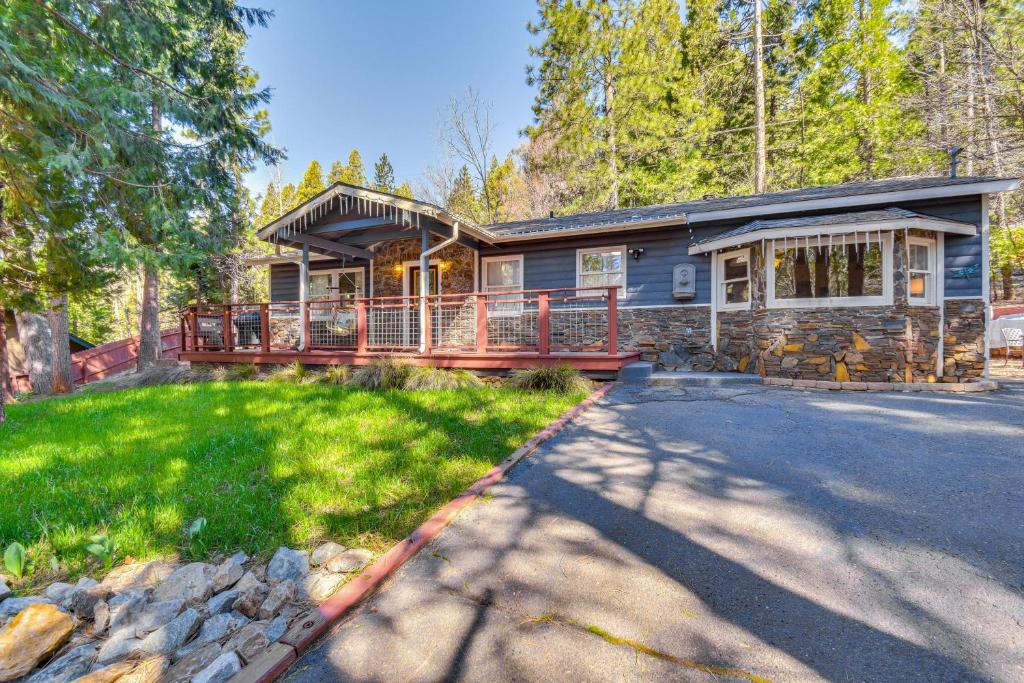 a log home with a large porch and a driveway at Lake Access & Hot Tub: Pet-Friendly Arnold Home in Arnold
