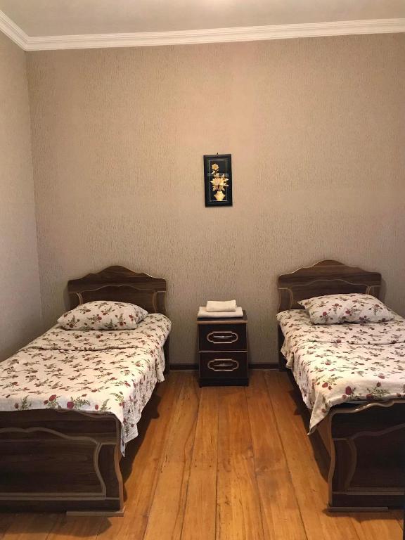 Postel nebo postele na pokoji v ubytování Guesthouse _ DAVITI