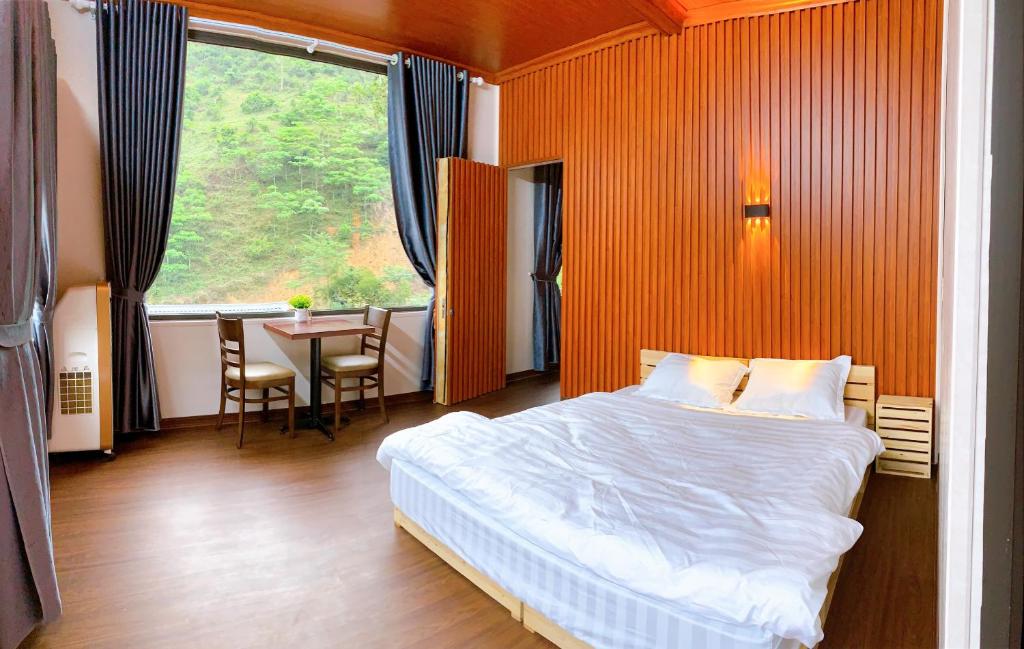 Cama o camas de una habitación en Homestay Chử Lầu Suối Giàng