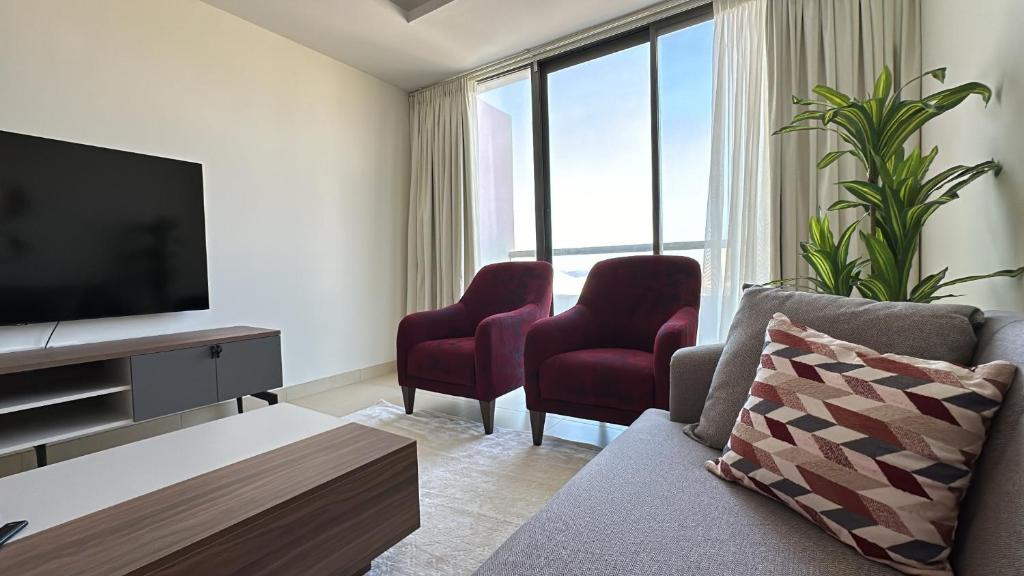 TV a/nebo společenská místnost v ubytování Elegant 3-Bed room Sea-View