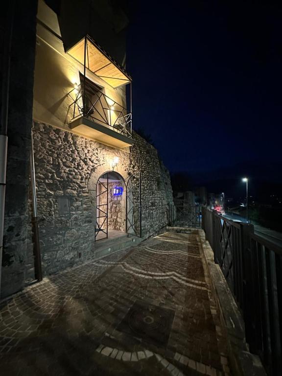 a stone building with a window at night at Bellavista bedroom in Isernia