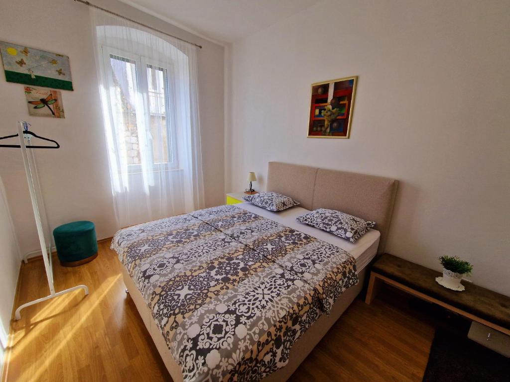 Postel nebo postele na pokoji v ubytování Downtown Apartment Nora