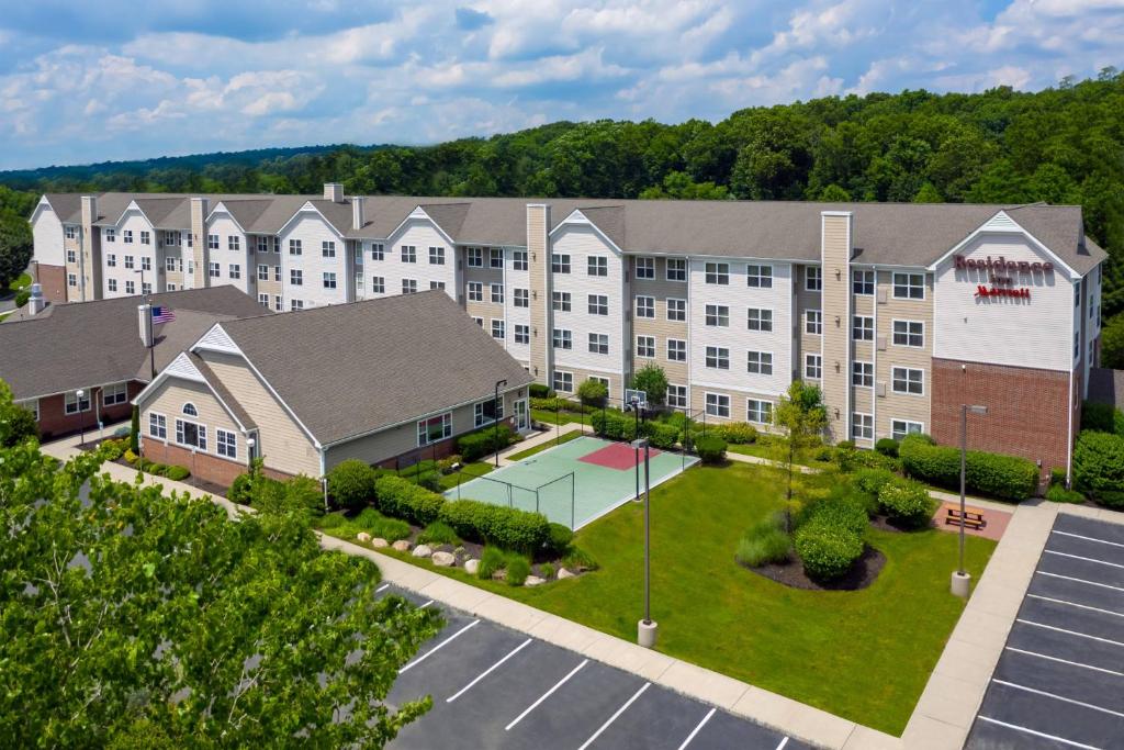 an aerial view of a building with a basketball court at Residence Inn Wayne in Wayne