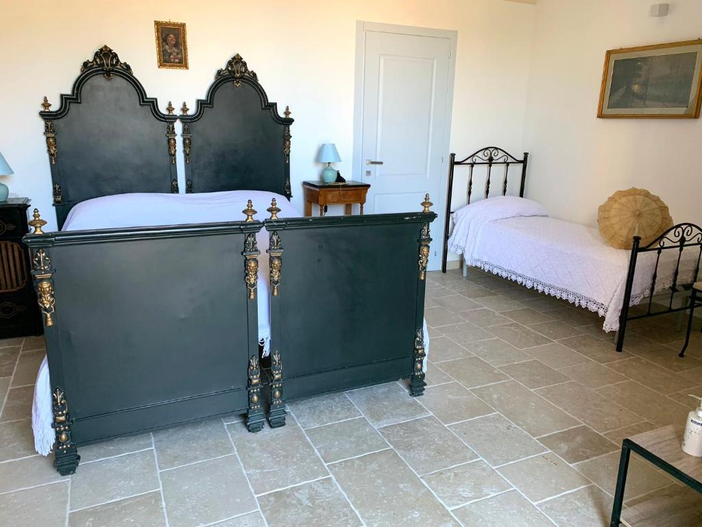 Postel nebo postele na pokoji v ubytování Casa Sipione Papa