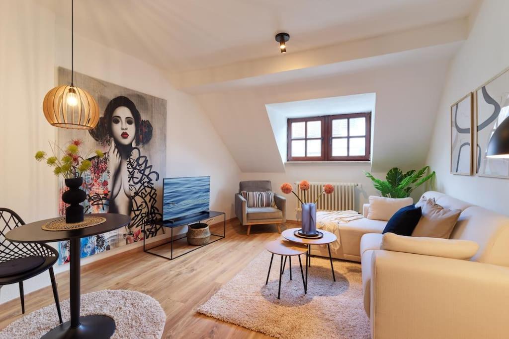 a living room with a couch and a table at Stilvolle Designer Wohnung im Herzen der Altstadt in Wittlich