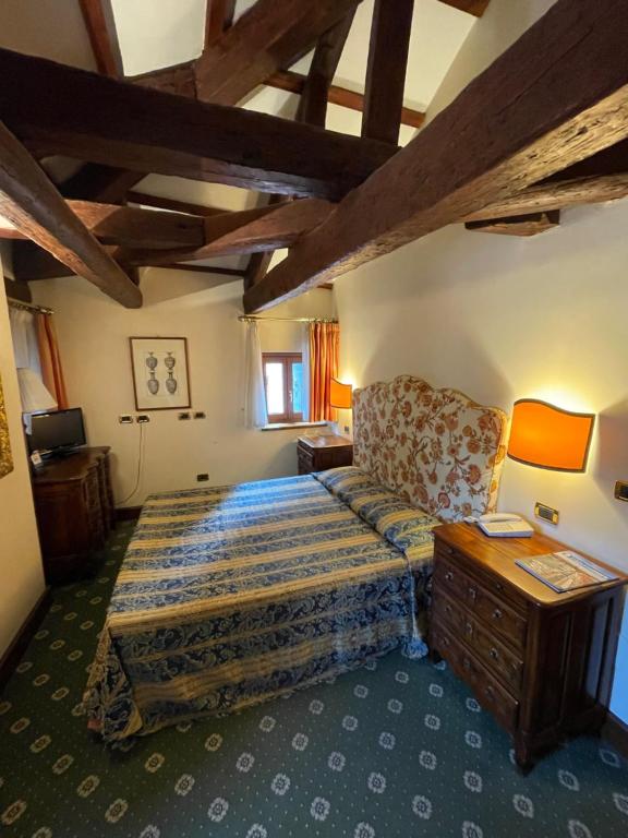 Postel nebo postele na pokoji v ubytování Hotel Corte Contarina