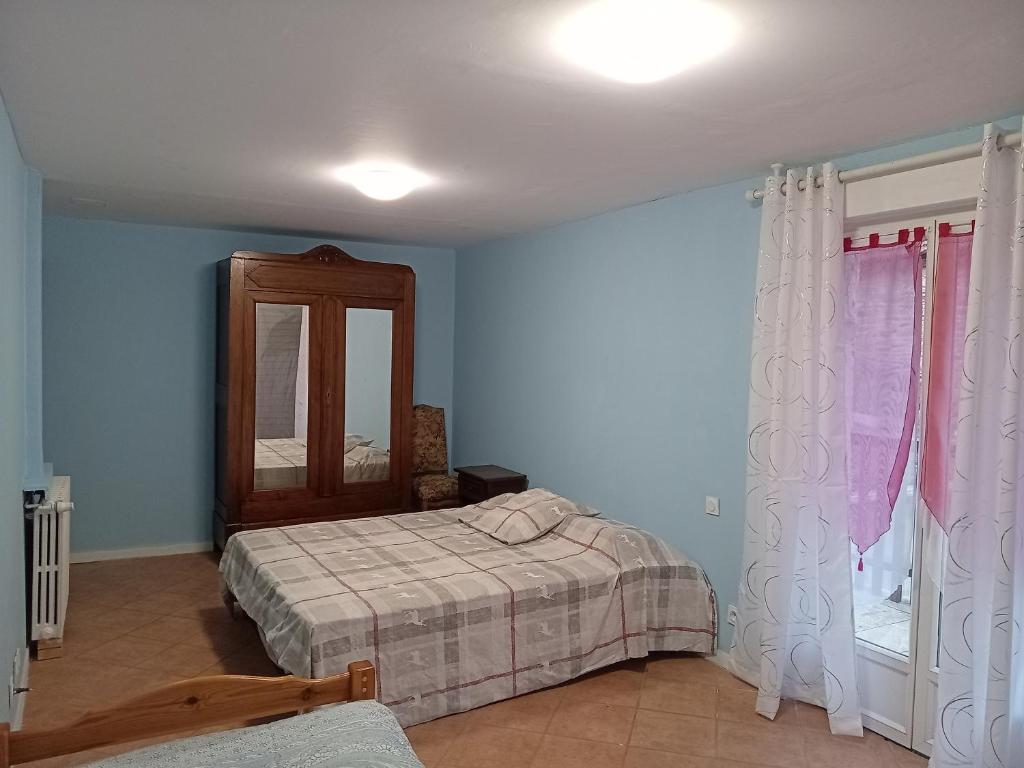 Postel nebo postele na pokoji v ubytování La Bergerie de Lavernhe
