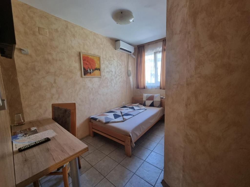 Postel nebo postele na pokoji v ubytování Jeweller Hotel