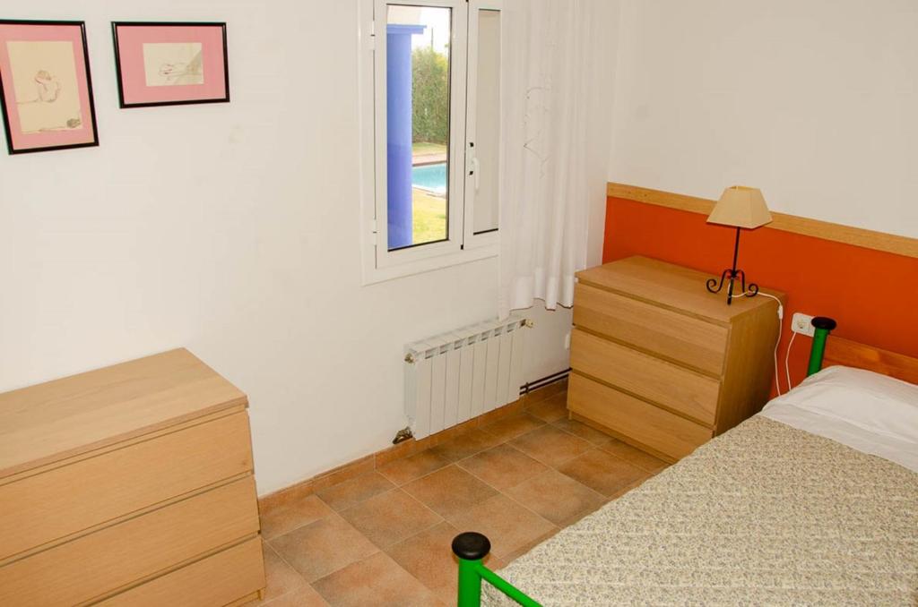 Postel nebo postele na pokoji v ubytování Les Columnes
