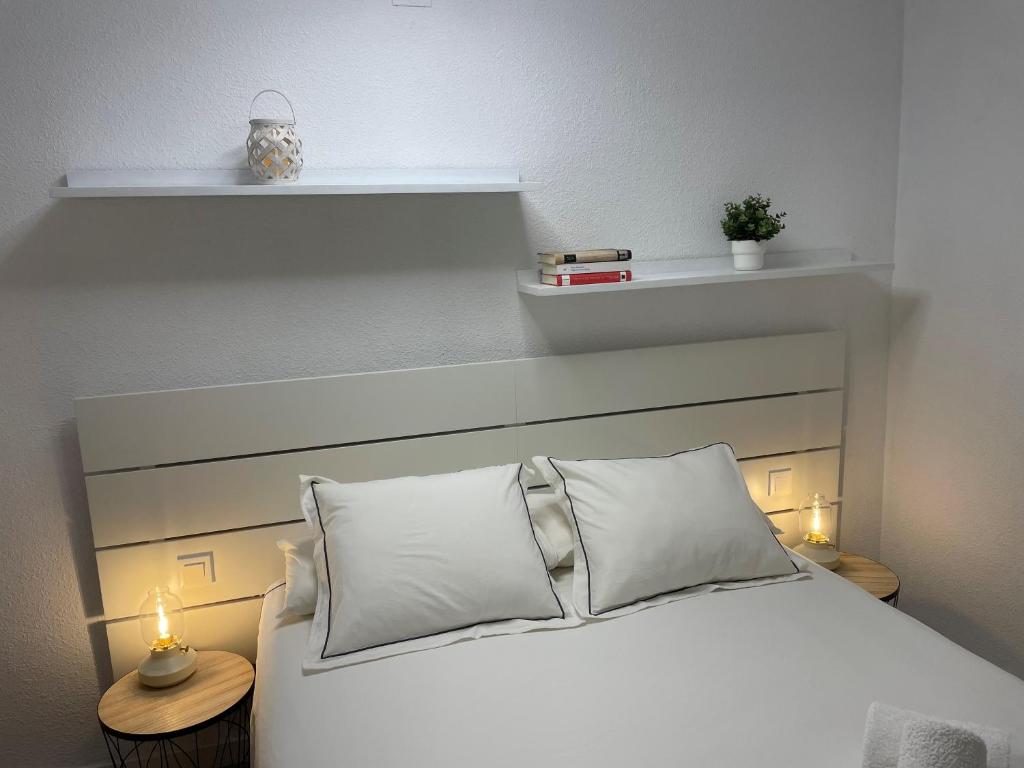 A bed or beds in a room at Vitaly Beach