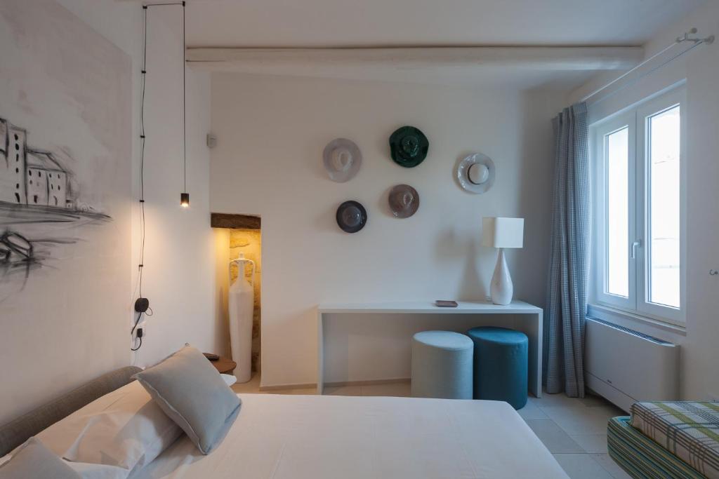 A bed or beds in a room at Palazzo Fiscaiolo