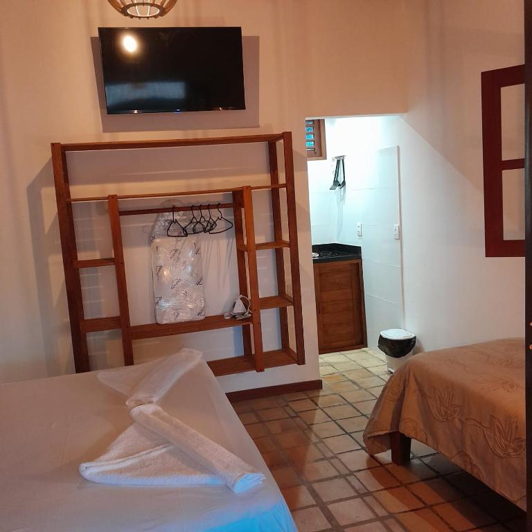Postel nebo postele na pokoji v ubytování Chalé Centro, Praia Pipa