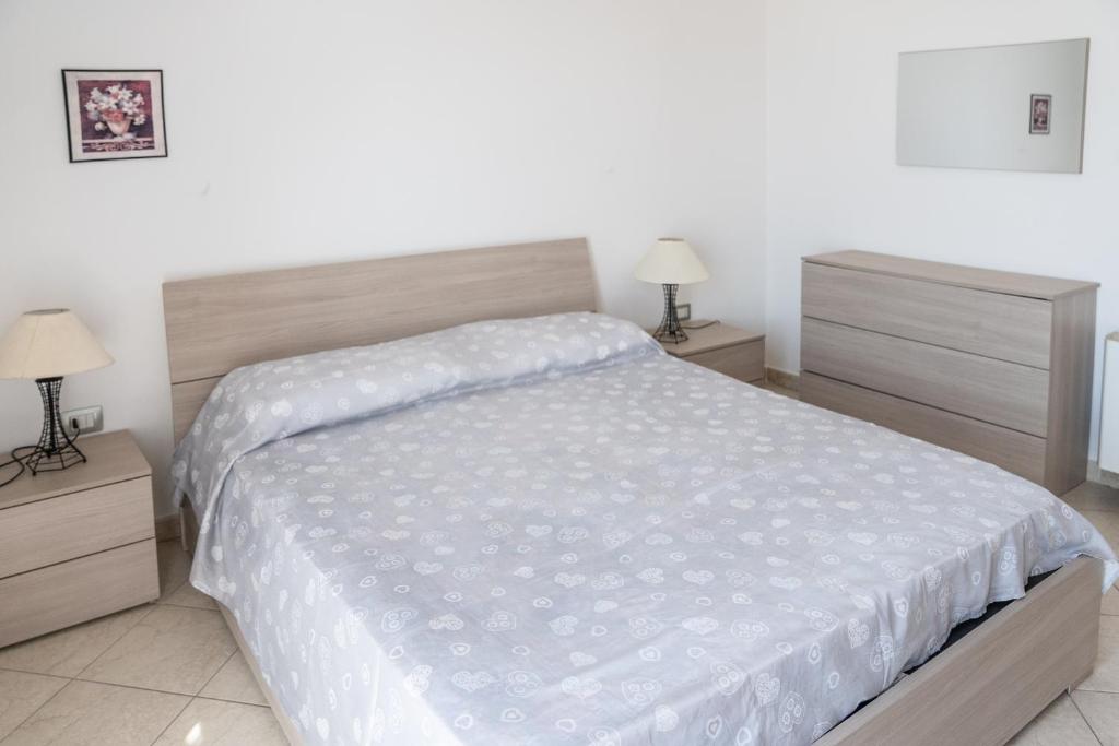Ένα ή περισσότερα κρεβάτια σε δωμάτιο στο Casa Graziosa