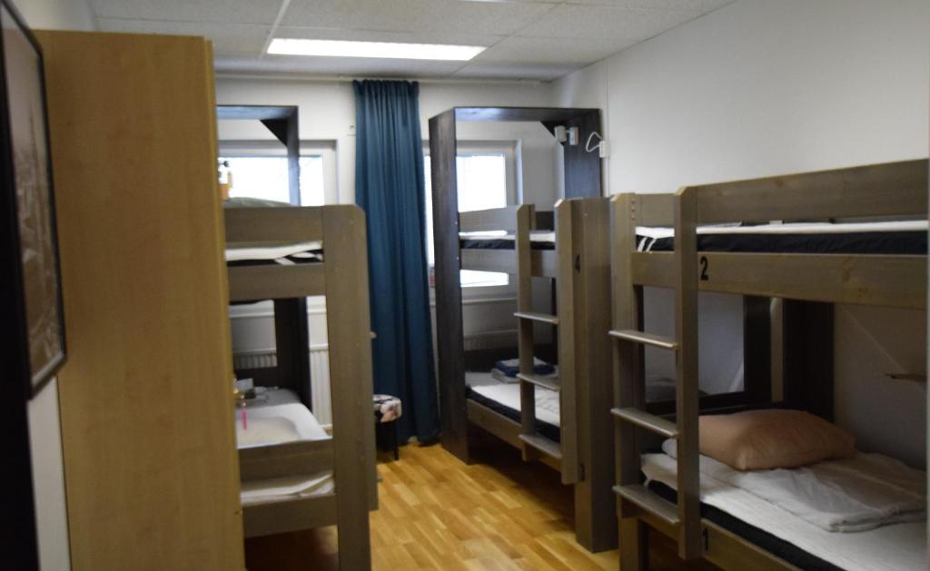 Postel nebo postele na pokoji v ubytování Hostel Snoozemore