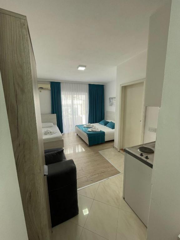 Postel nebo postele na pokoji v ubytování Molla Apartments