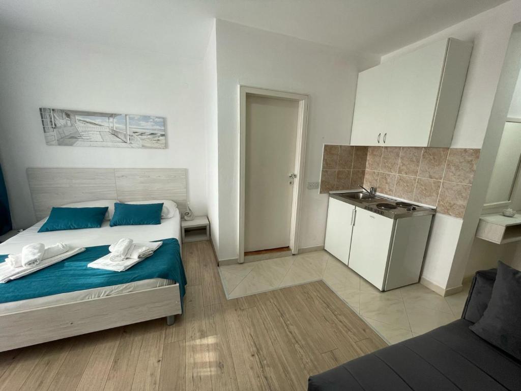 Postel nebo postele na pokoji v ubytování Molla Apartments