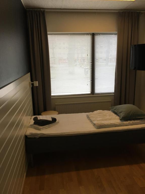 Postel nebo postele na pokoji v ubytování Hostel Snoozemore