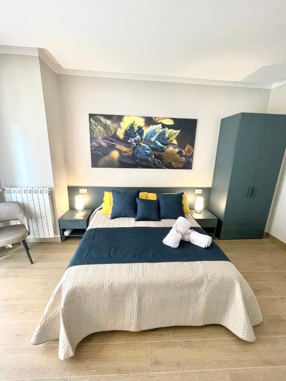 Postel nebo postele na pokoji v ubytování COLOMBO SUITE