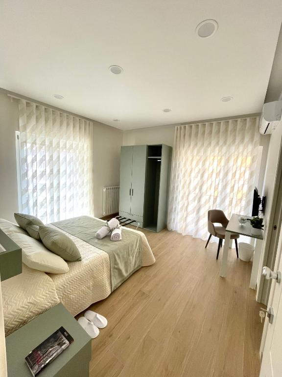Postel nebo postele na pokoji v ubytování COLOMBO SUITE