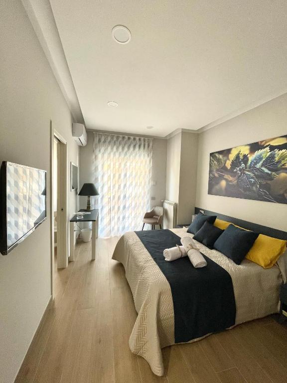 Postel nebo postele na pokoji v ubytování COLOMBO SUITE