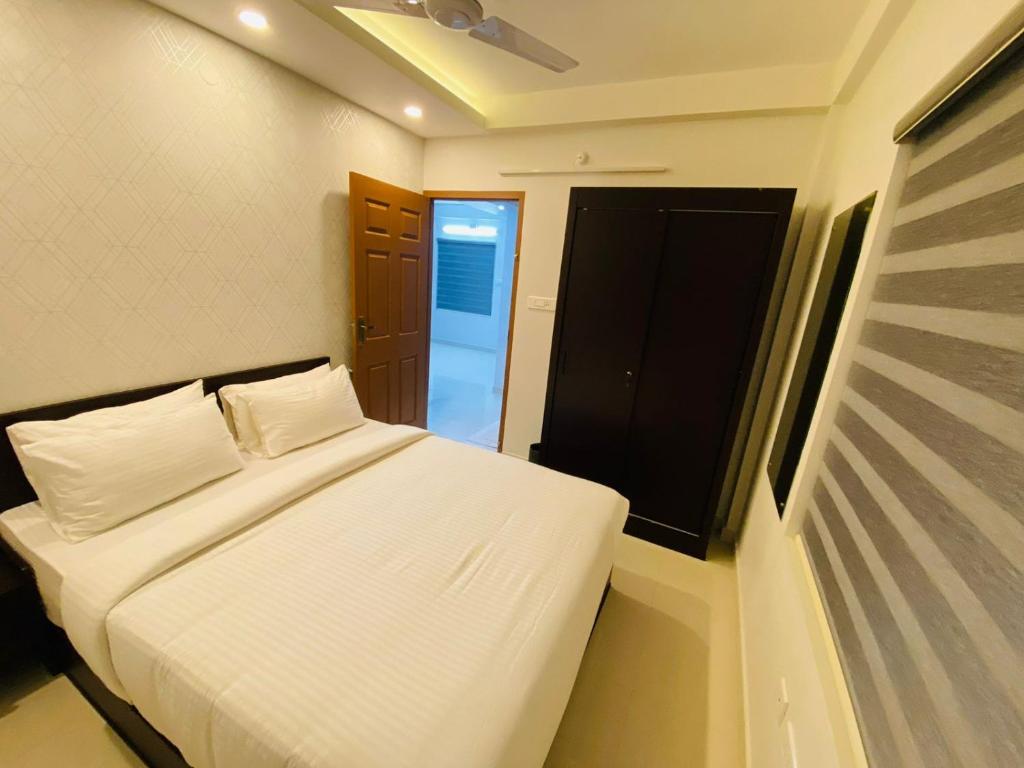 Postel nebo postele na pokoji v ubytování Nujoom Apartments