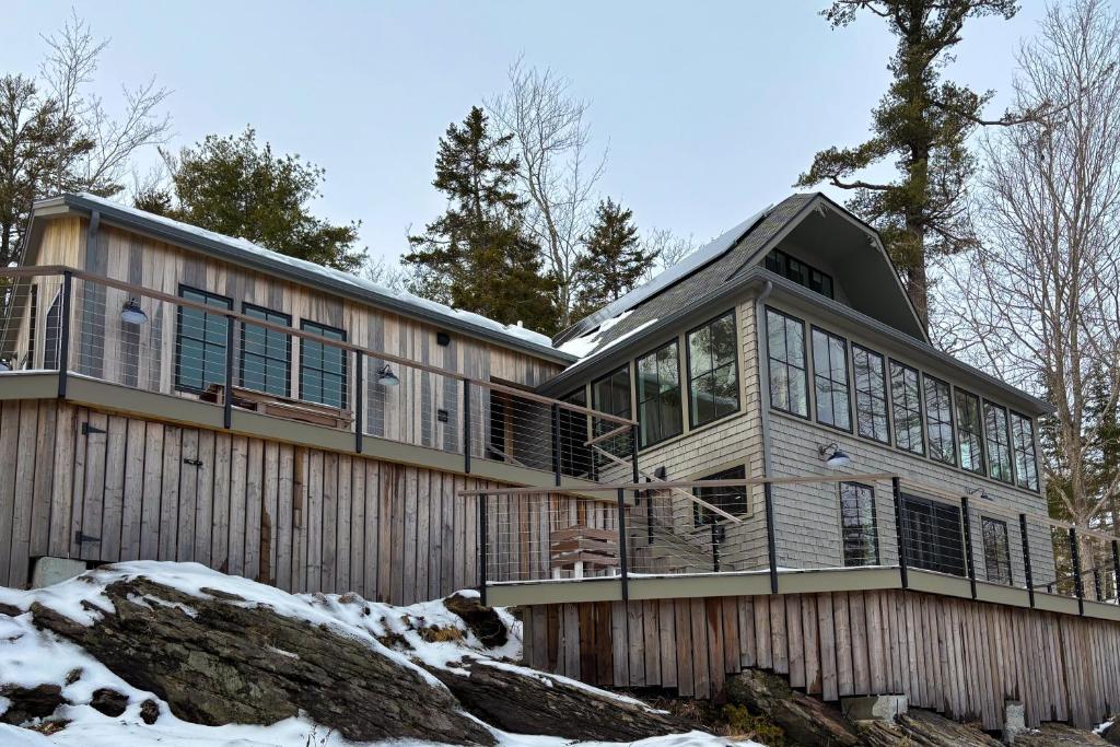 an exterior view of a house in the snow at Cottage on the Coast in Rockport