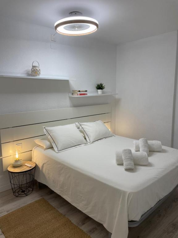 A bed or beds in a room at Vitaly Beach