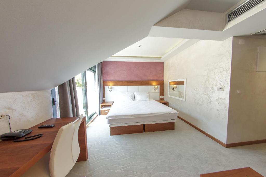 Postel nebo postele na pokoji v ubytování Hotel Porto In