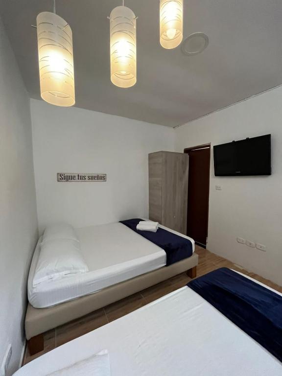 Postel nebo postele na pokoji v ubytování Hotel Coffee Real Pereira