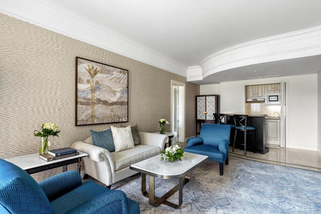 a living room with a couch and chairs and a table at Intercontinental Cairo Citystars by IHG in Cairo