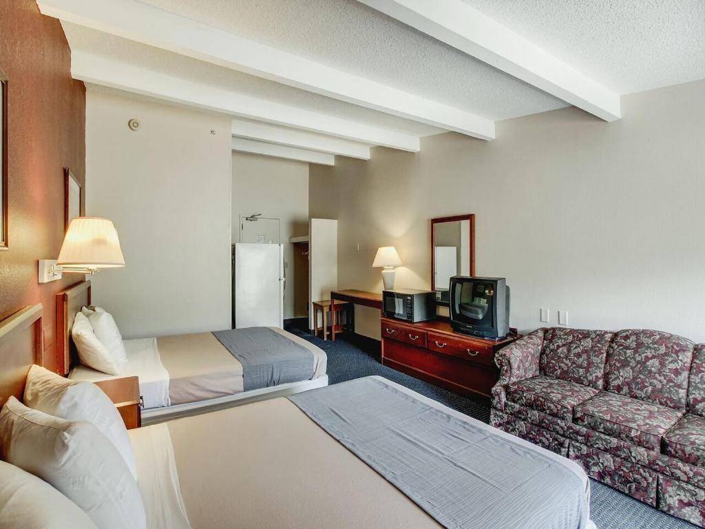 Postel nebo postele na pokoji v ubytování Scottish Inn Whippany