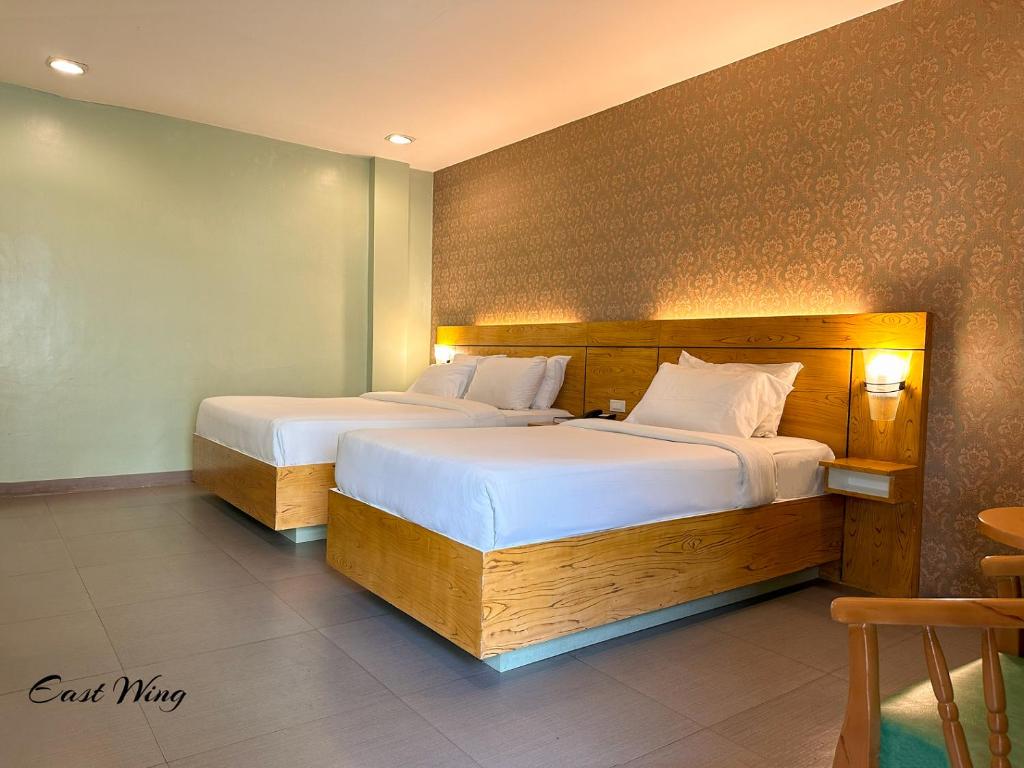 Postel nebo postele na pokoji v ubytování LM METRO HOTEL