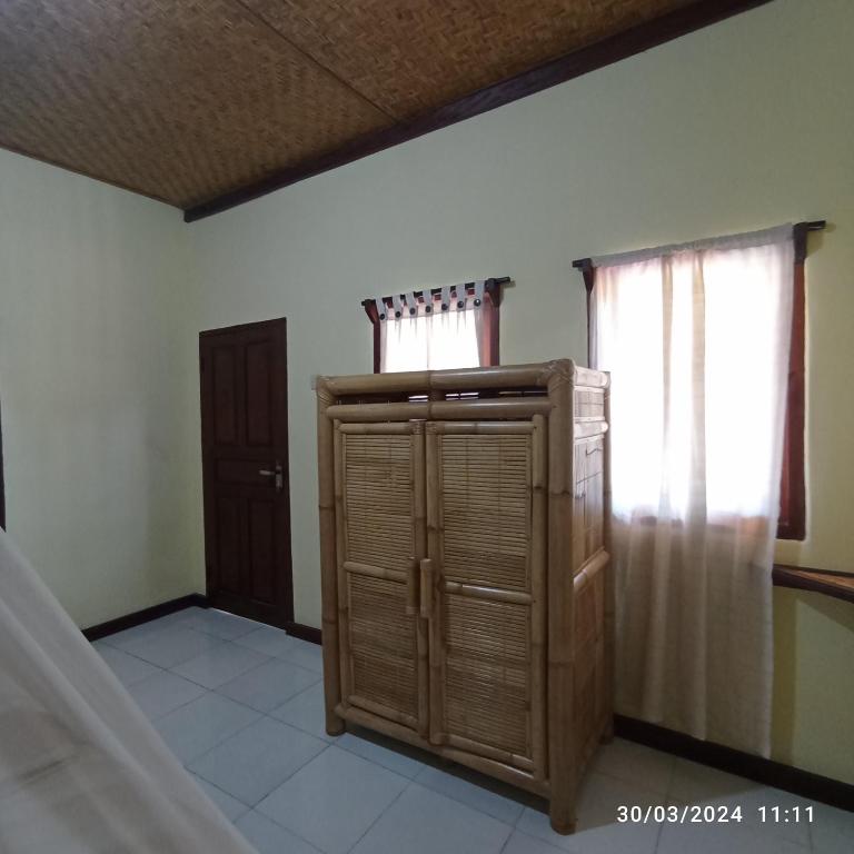 Postel nebo postele na pokoji v ubytování Tangga Bungalows Gili Air