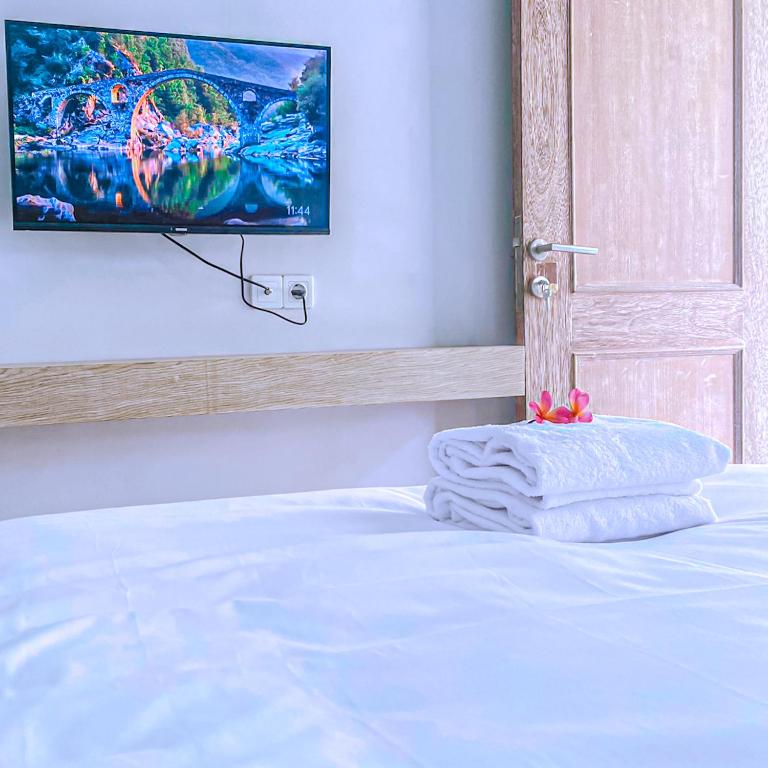 Postel nebo postele na pokoji v ubytování Manuver Surf And Stay Uluwatu Bali