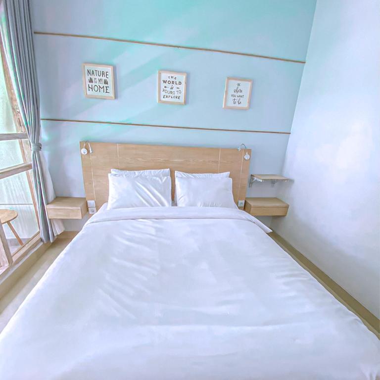 Postel nebo postele na pokoji v ubytování Manuver Surf And Stay Uluwatu Bali