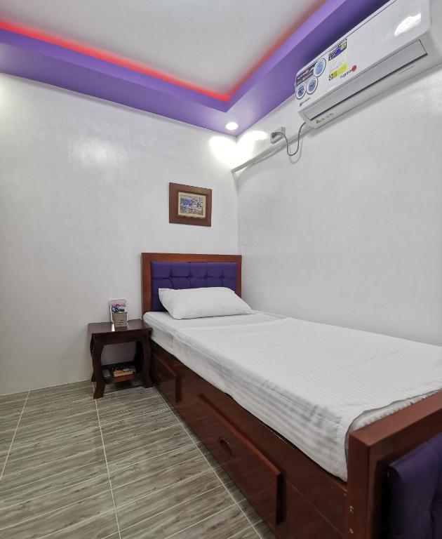 Postel nebo postele na pokoji v ubytování Homelux Transient House