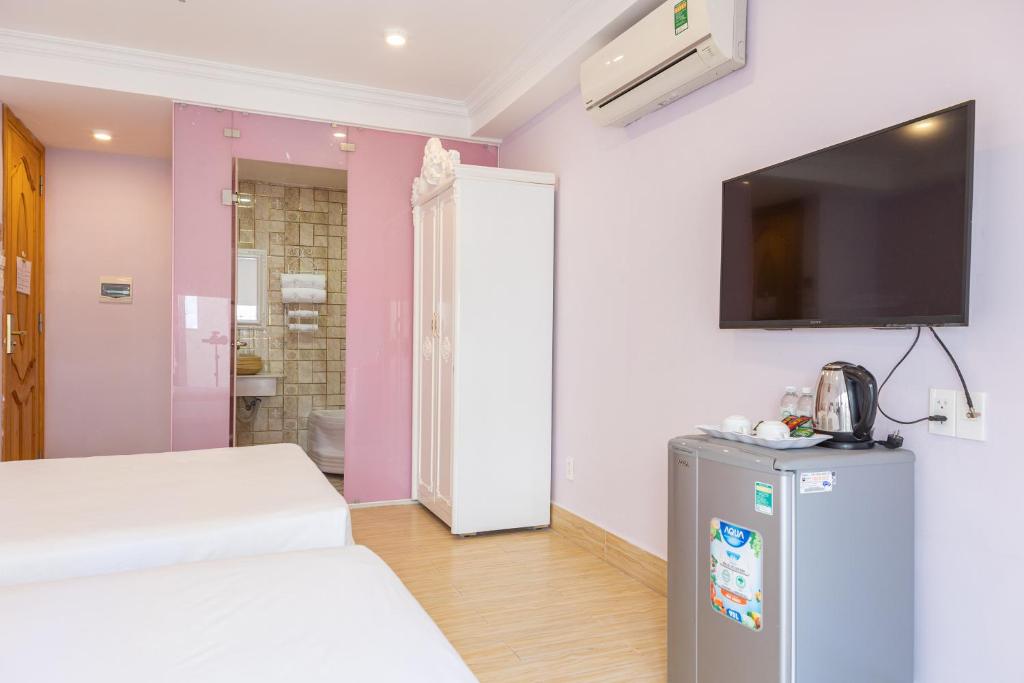 Giường trong phòng chung tại Happy Star Hotel Nha Trang