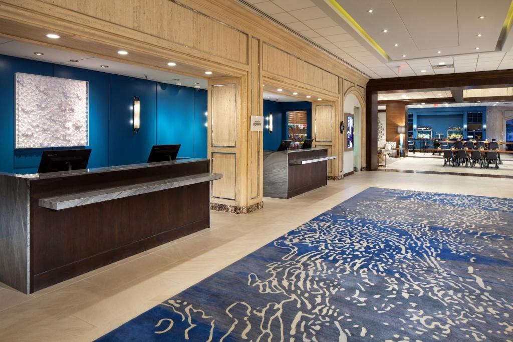 an office lobby with a blue wall at The Westin Oaks Houston at the Galleria in Houston