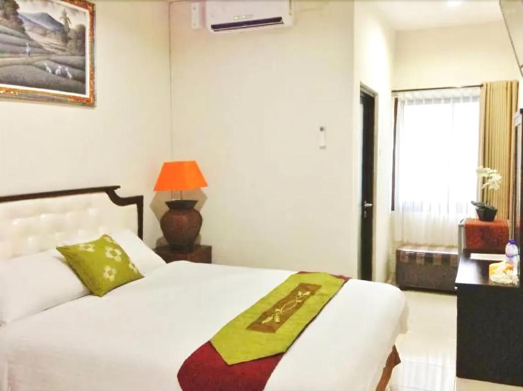 Voodi või voodid majutusasutuse Tuban Torres Accommodation toas