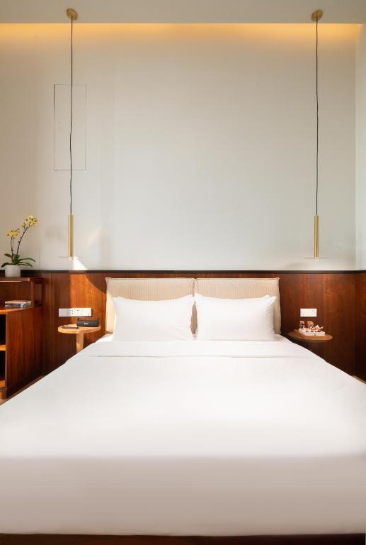 Katil atau katil-katil dalam bilik di Wuyu Hotel, Smart Park & Happy Valley Jinshansi Metro