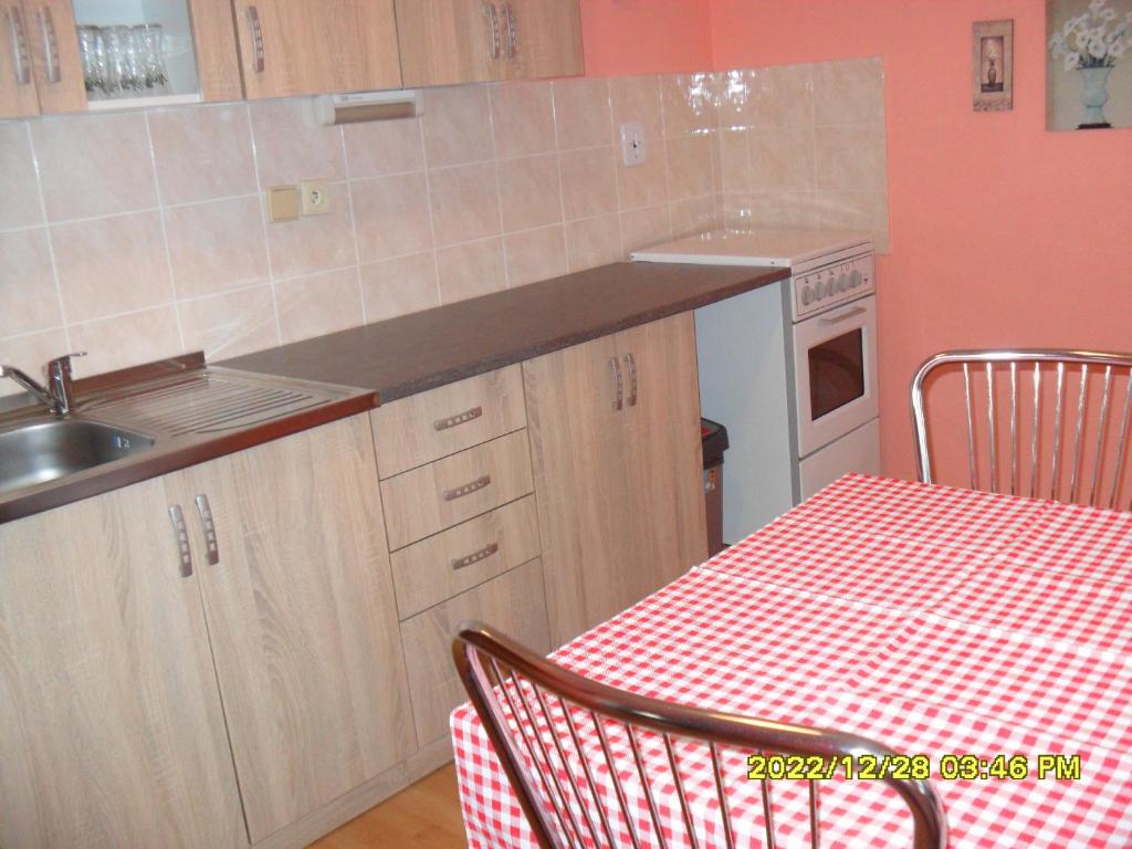 Kuchyň nebo kuchyňský kout v ubytování Apartmány Prima