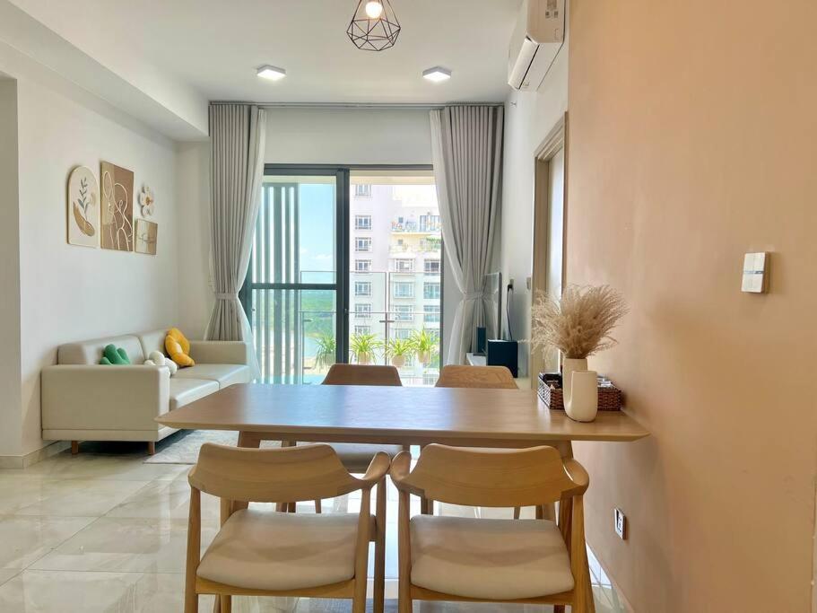 a dining room with a table and some chairs at The Ascentia - Scandinavian apartment - Near SECC, Mall in Ho Chi Minh City