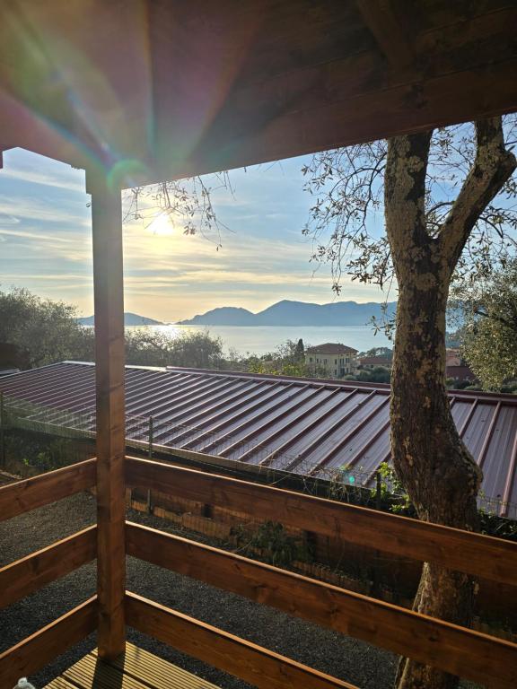 a view from the porch of a house with a tree at Campeggio Gianna Golfo dei Poeti in Lerici