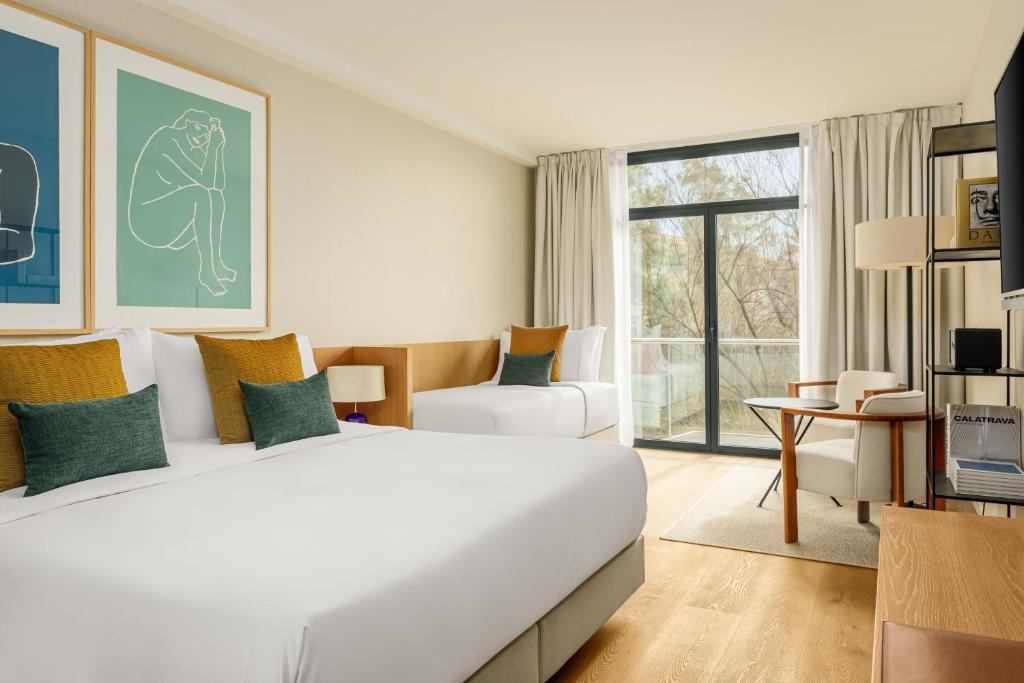 Postel nebo postele na pokoji v ubytování AC Hotel Gava Mar