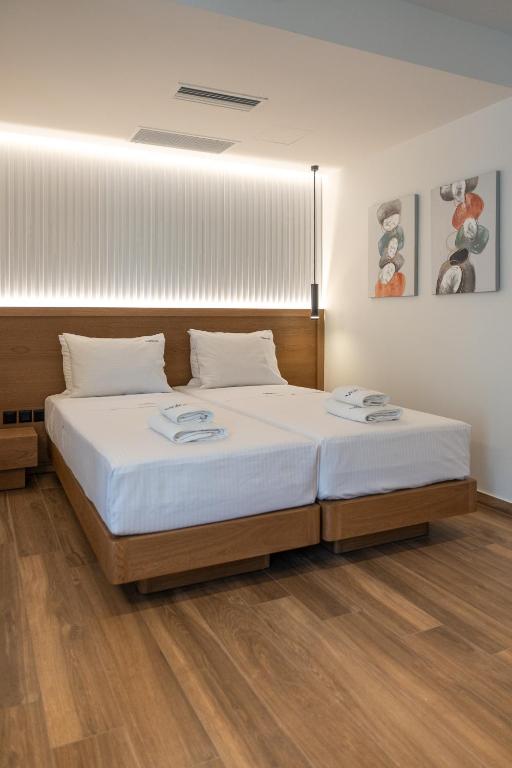 Postel nebo postele na pokoji v ubytování Volos Inn Hotel
