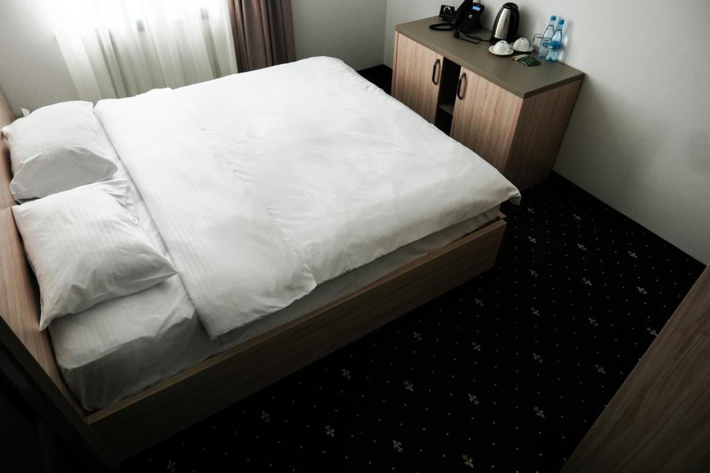 Postel nebo postele na pokoji v ubytování Colette Hotel