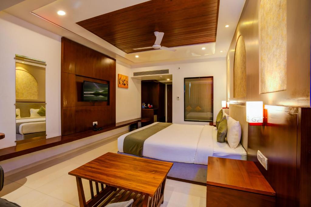 Postel nebo postele na pokoji v ubytování KAMAT'S DAFFODIL RESORT GOA