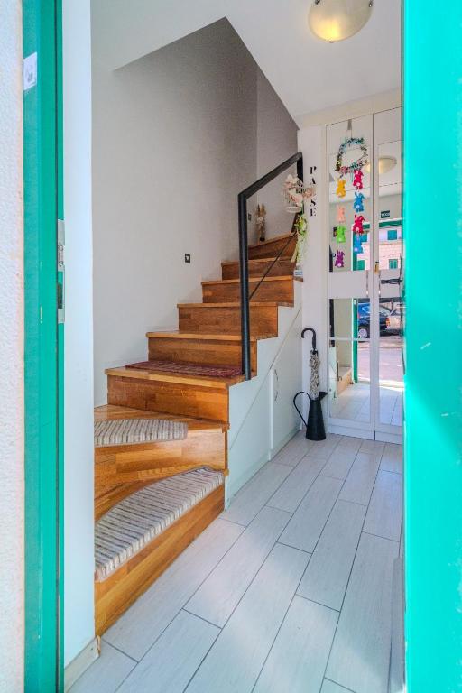a room with a staircase with wooden risers at Central Split rooms and apartments Paese in Split