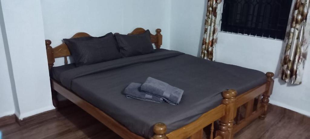 Postel nebo postele na pokoji v ubytování Casa Hillary Guest House